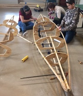 Students build a kayak as part of their project-based learning.